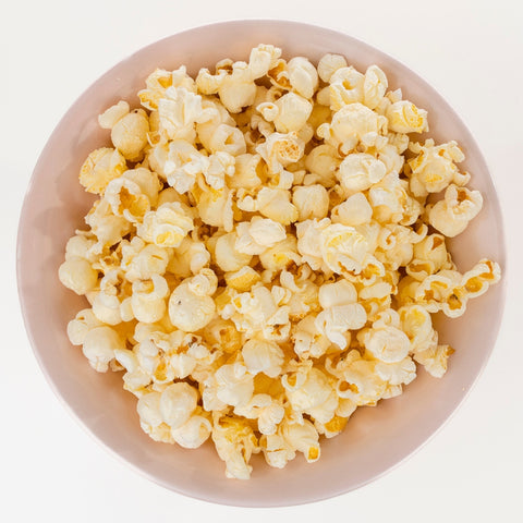 Bowl filled with Del's seasoned popcorn, ready to serve