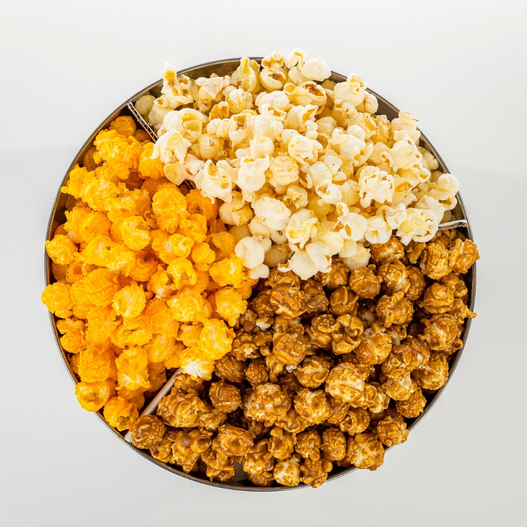 Del's three flavor popcorn tin with cheese, seasoned, and caramel popcorn