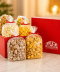 Del's Signature Gift Box with Caramel Corn, Kettle Korn, Cheese Corn, Vanilla Candy Corn, White Chocolate Popcorn, and a Caramel Corn with Peanuts.