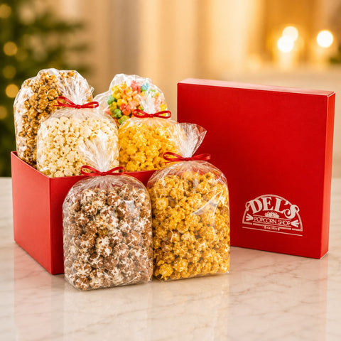 Del's Signature Gift Box with Caramel Corn, Kettle Korn, Cheese Corn, Vanilla Candy Corn, White Chocolate Popcorn, and a Caramel Corn with Peanuts.