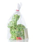 Green popcorn Easter bunny packed in a transparent cellophane bag