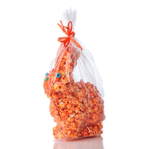 Orange popcorn bunny made for Easter celebrations - wrapped in transparent cellophane  