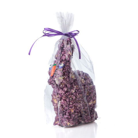 Purple popcorn bunny wrapped in transparent cellophane on a white background
