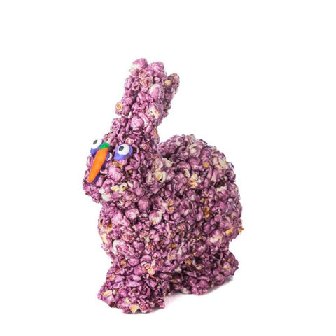 Purple popcorn bunny for Easter with an orange beak on a white background