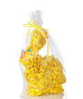 Yellow popcorn Easter bunny packed in transparent cellophane with a yellow bow