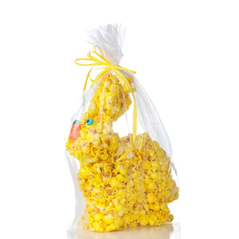 Yellow popcorn Easter bunny packed in transparent cellophane with a yellow bow
