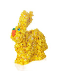 Yellow popcorn bunny with blue eyes and carrot beak.