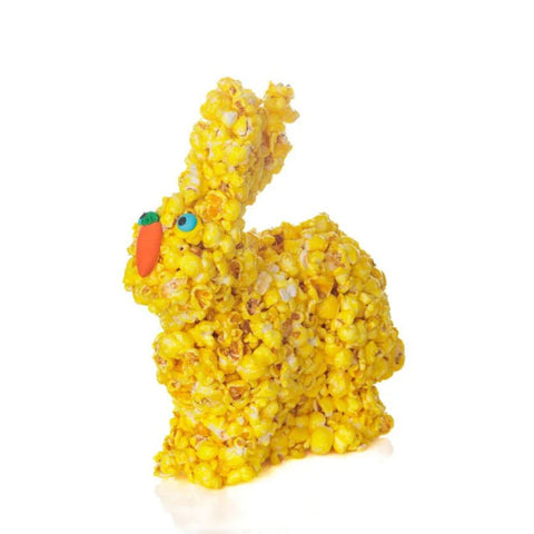 Yellow popcorn bunny with blue eyes and carrot beak.
