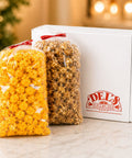 Medium White Del's Popcorn Gift Box with gourmet caramel and cheese popcorn.