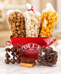 Assorted popcorn and treats in a Square Red Del's Market Tray with 'Del's Popcorn Shop' branding.