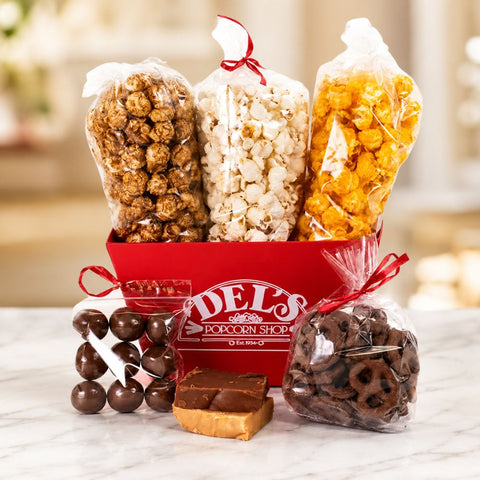 Assorted popcorn and treats in a Square Red Del's Market Tray with 'Del's Popcorn Shop' branding.
