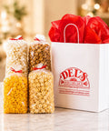 The Crowd Pleaser gourmet popcorn gift box with caramel corn, cheese corn, kettle corn, and seasoned popcorn from Del's Popcorn Shop