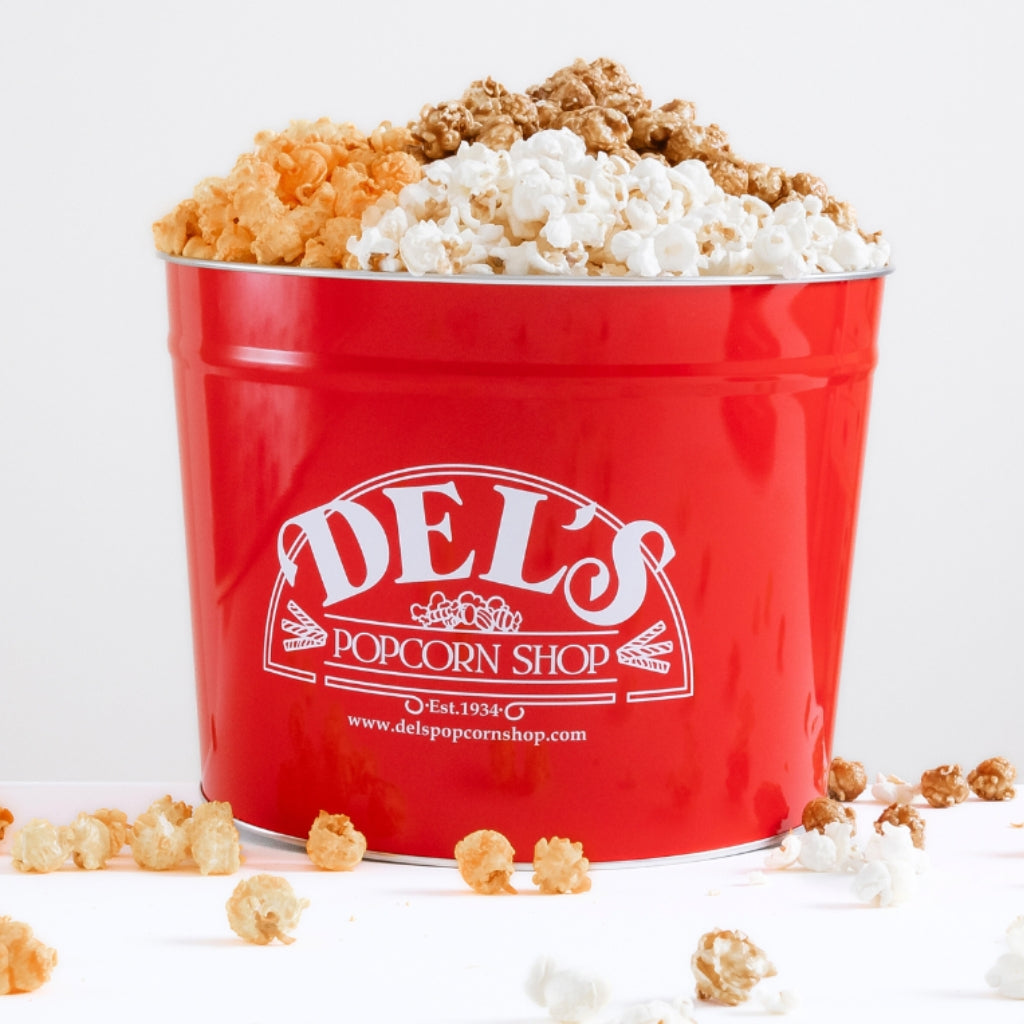Del's three flavor popcorn tin with cheese, caramel, and kettle corn